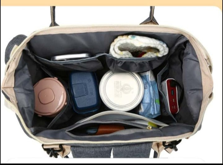 Inside view of a backpack for parents, featuring multiple storage solutions for all of baby’s essentials. Each backpack has multiple pockets, including a separate zipped compartment which is perfect for storing smaller items, such as dummies.