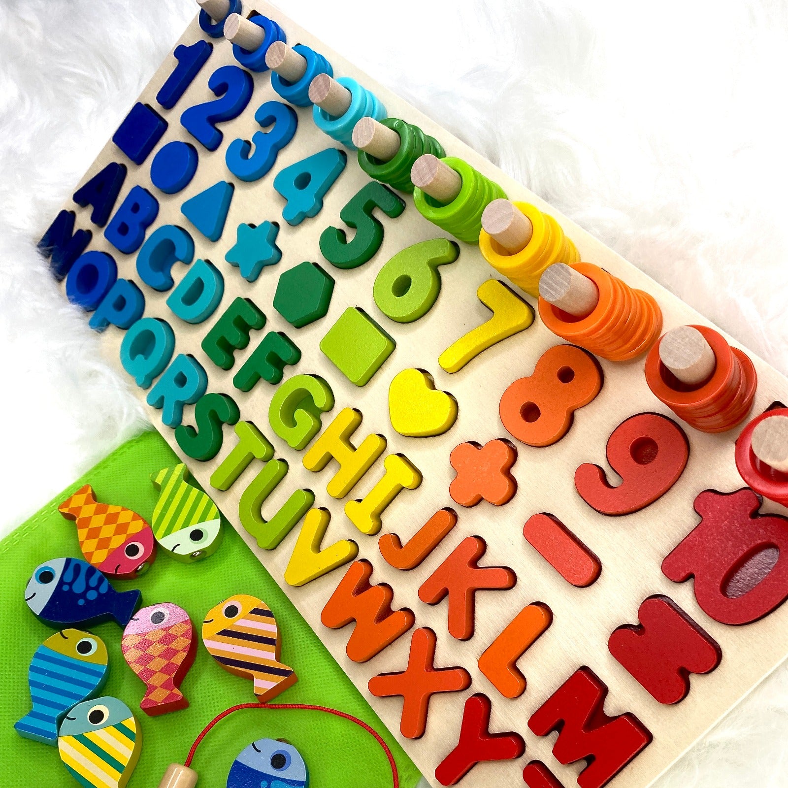 A multifunctional children’s wooden puzzle toy, featuring colourful shapes, numbers, counting rings and a magnetic fish game.
