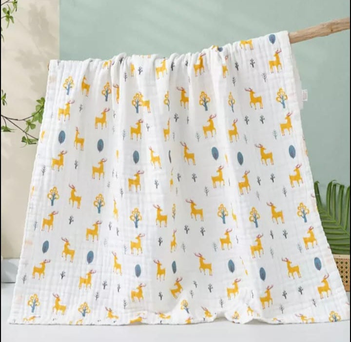 A large muslin baby blanket, made from bamboo and cotton fibres. This blanket is perfect for a baby nursery or out and about in a buggy. The blanket features a cute reindeer pattern.