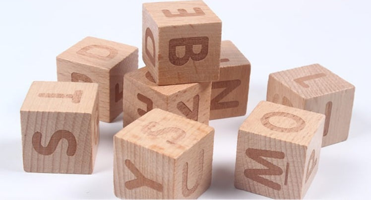 A children's wooden alphabet blocks spelling toy, with wooden letter blocks and spelling cards.